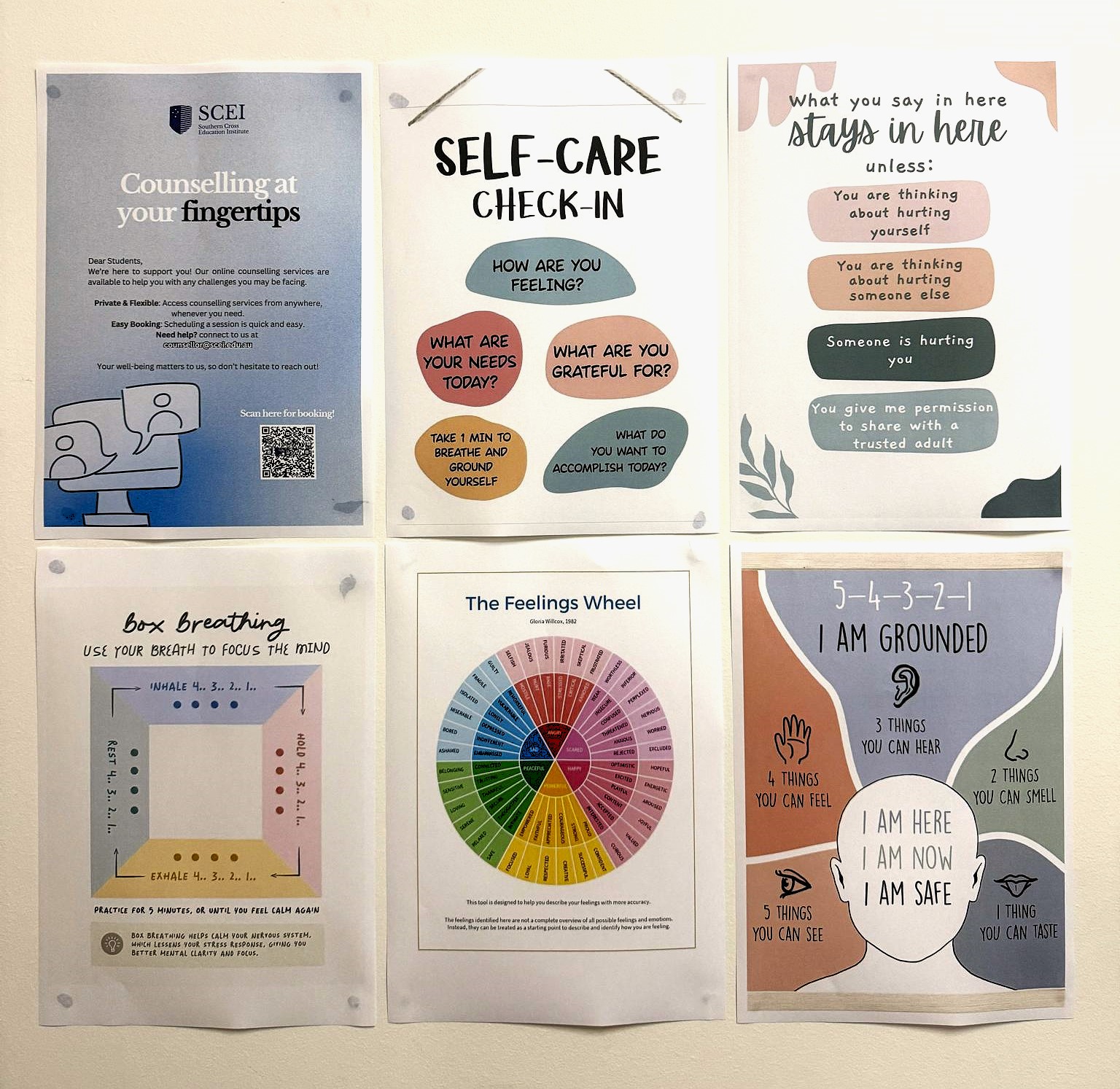 A counselling room wall displaying six wellbeing posters